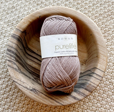 a ball of beige cotton yarn 50g ball