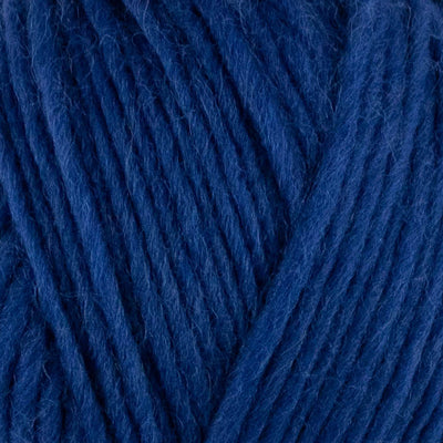 a close up of british bluefaced kerry hill fleece in dark blue chunky weight yarn for knitting weaving or crochet
