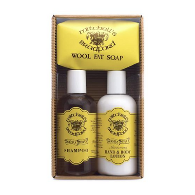 a set of lanolin soaps a bottle of wool fat lanolin shampoo a bottle of wool fat lanolin hand and body lotion a bar of wool fat lanolin soap