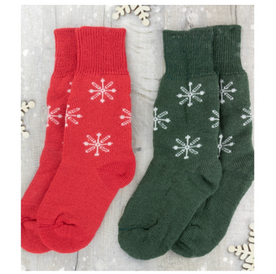 two socks knitted in west yorkshire spinners 4ply sock yarn one pair of red socks with white snowflakes one pair of green socks with white snowflakes