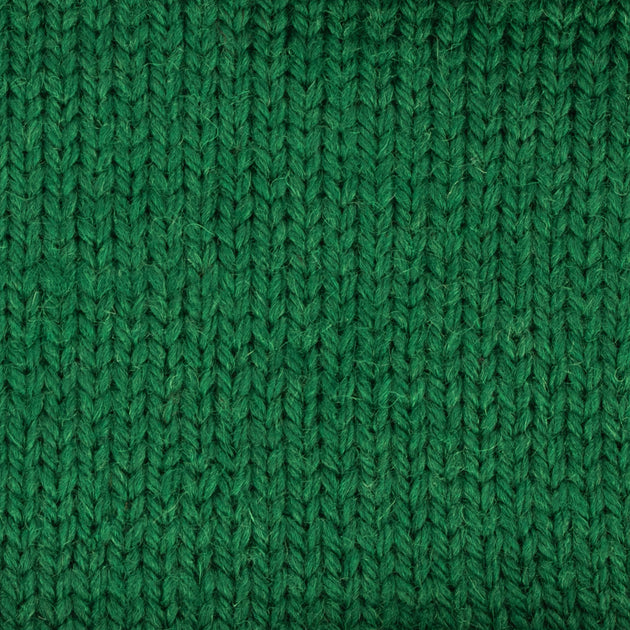 a close up of a knitted swatch green weight skein machine washable for knitting crocheting and weaving