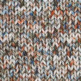 close up of knitted orange blue green white aran weight skein machine washable for knitting crocheting and weaving