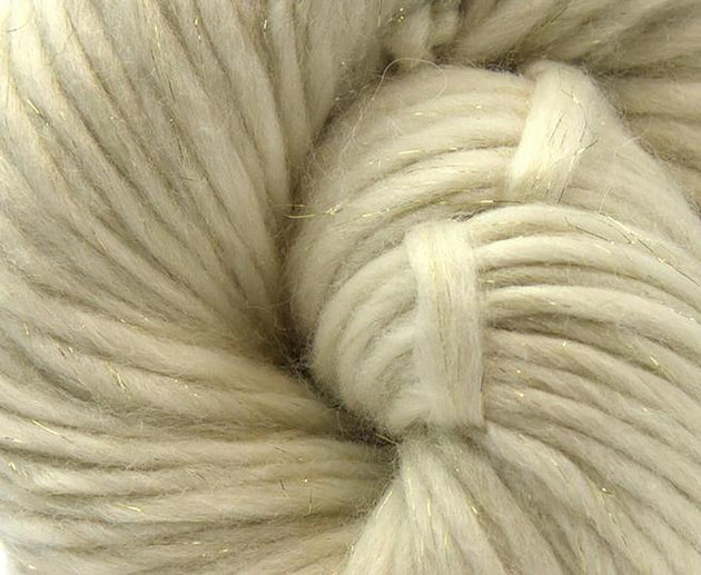 close up photo of white cream chunky weight merino 200g ball for knitting crocheting and weaving