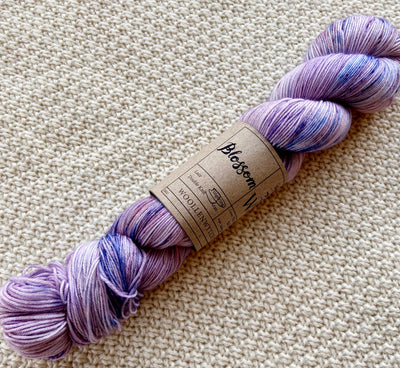 lilac purple fingering weight yarn in a 100g skein