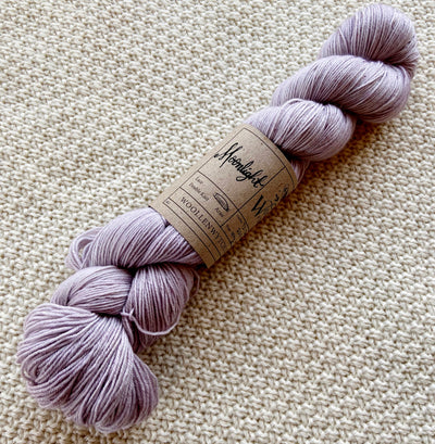 light pink fingering weight yarn in a 100g skein