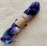 dark purple blue white lilac turquoise lace weight yarn in a 50g skein