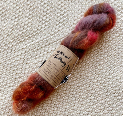 red purple orange lace weight yarn in a 50g skein