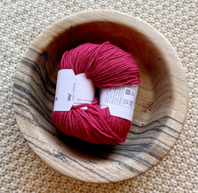 a ball of red pink dk double knit organic cotton 50g ball