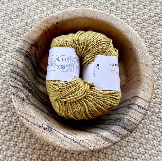 a ball of mustard yellow dk double knit organic cotton 50g ball