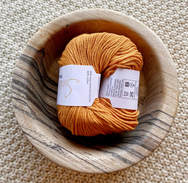 a ball of orange dk double knit organic cotton 50g ball
