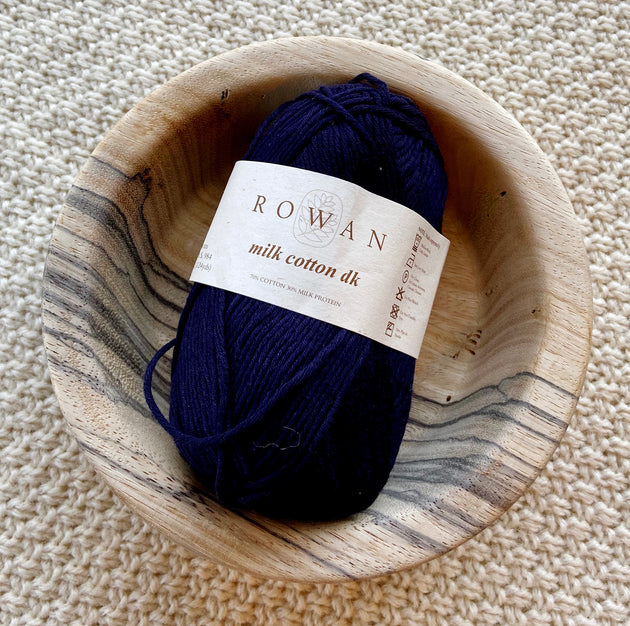 a ball of dark blue dk double knit cotton Milk Protein yarn 50g ball