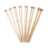 seven pairs of straight bamboo knitting needles 