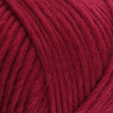 a close up of british bluefaced kerry hill fleece in burgundy chunky weight yarn for knitting weaving or crochet
