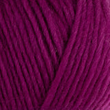 a close up of british bluefaced kerry hill fleece in purple pink chunky weight yarn for knitting weaving or crochet