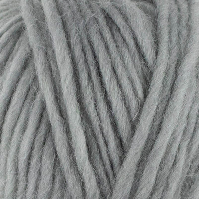 a close up of british bluefaced kerry hill fleece in light grey chunky weight yarn for knitting weaving or crochet