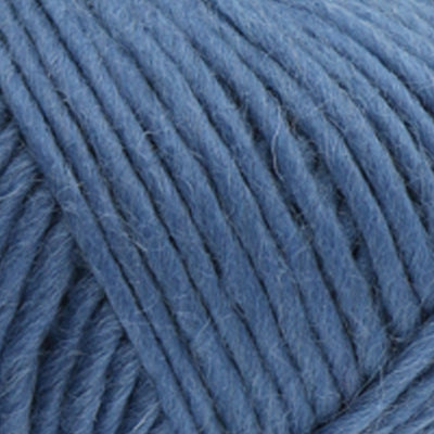 a close up of british bluefaced kerry hill fleece in blue chunky weight yarn for knitting weaving or crochet