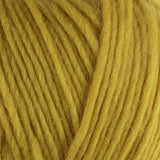 a close up of british bluefaced kerry hill fleece in yellow chunky weight yarn for knitting weaving or crochet