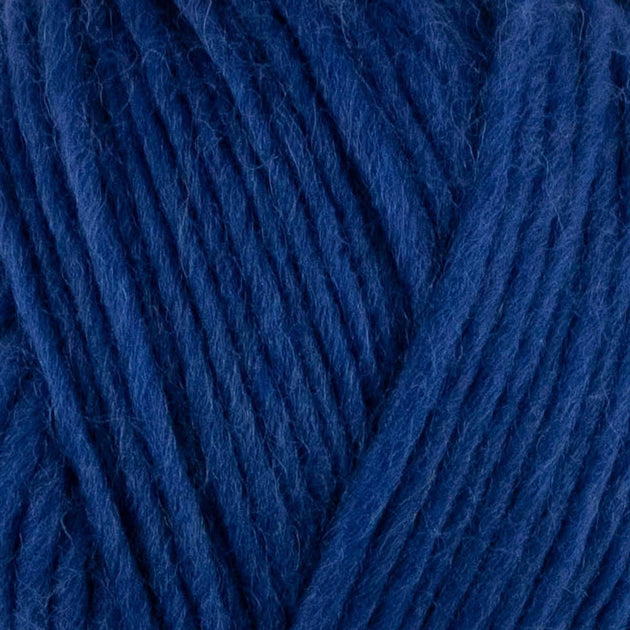 a close up of british bluefaced kerry hill fleece in dark blue chunky weight yarn for knitting weaving or crochet