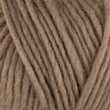 a close up of british bluefaced kerry hill fleece in light brown chunky weight yarn for knitting weaving or crochet
