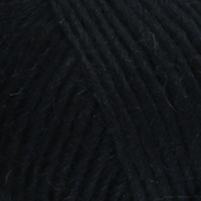 a close up of british bluefaced kerry hill fleece in black chunky weight yarn for knitting weaving or crochet