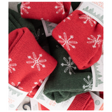a photo of multiple pairs of the red and green christmas socks on top of each other by west yorkshire spinners 