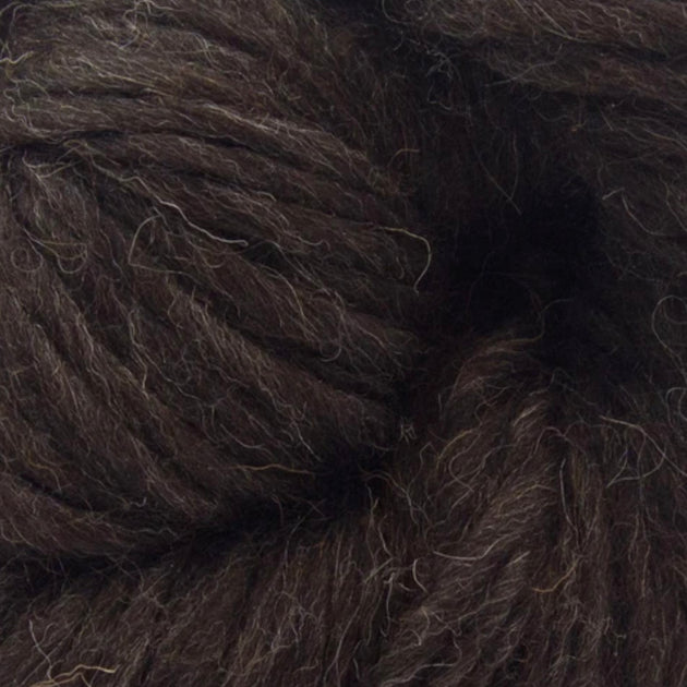 a close up of a skein of brown black super chunky british yarn 200g