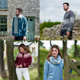 man wearing blue knitted jumper and scarf man wearing grey jumper woman wearing red and white cardigan woman wearing blue and white jumper 