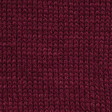 close up of knitted burgundy red aran weight skein machine washable for knitting crocheting and weaving