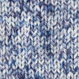 close up knitted blue white aran weight skein machine washable for knitting crocheting and weaving