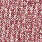 a close up of a knitted swatch red pink white orange aran weight skein machine washable for knitting crocheting and weaving