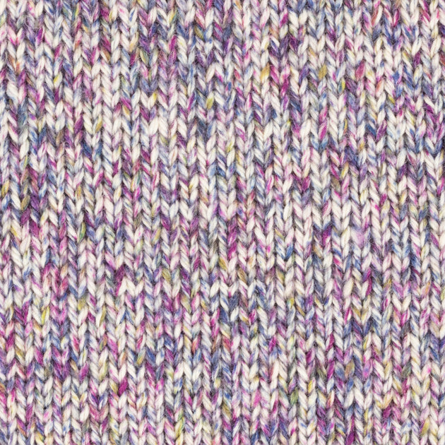 a close up of a knitted swatch white purple yellow pink aran weight skein machine washable for knitting crocheting and weaving