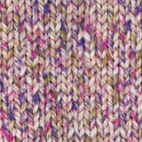 close up of knitted mustard yellow pink purple white  red aran weight skein machine washable for knitting crocheting and weaving
