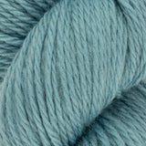 close up of blue aran weight skein machine washable for knitting crocheting and weaving