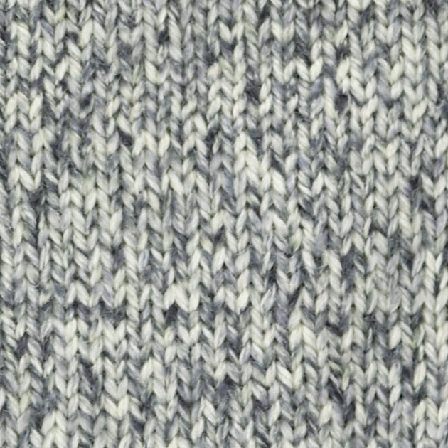 close up of knitted white black grey aran weight skein machine washable for knitting crocheting and weaving