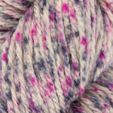 close up of white grey pink aran weight skein machine washable for knitting crocheting and weaving