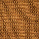 close up of knitted orange mustard aran weight skein machine washable for knitting crocheting and weaving