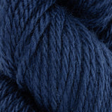 close up of dark blue navy aran weight skein machine washable for knitting crocheting and weaving