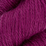 close up of purple pink aran weight skein machine washable for knitting crocheting and weaving