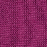 close up of knitted purple pink aran weight skein machine washable for knitting crocheting and weaving
