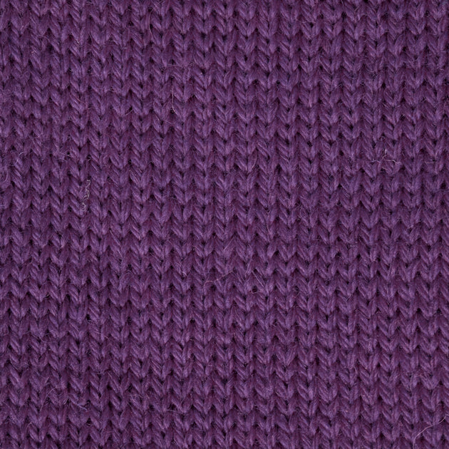 close up of a knitted swatch of dark purple aran weight skein machine washable for knitting crocheting and weaving