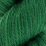 close up of green aran weight skein machine washable for knitting crocheting and weaving