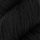 a close up of black aran weight skein machine washable for knitting crocheting and weaving