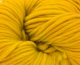 close up photo of mustard yellow chunky weight merino 200g ball for knitting crocheting and weaving